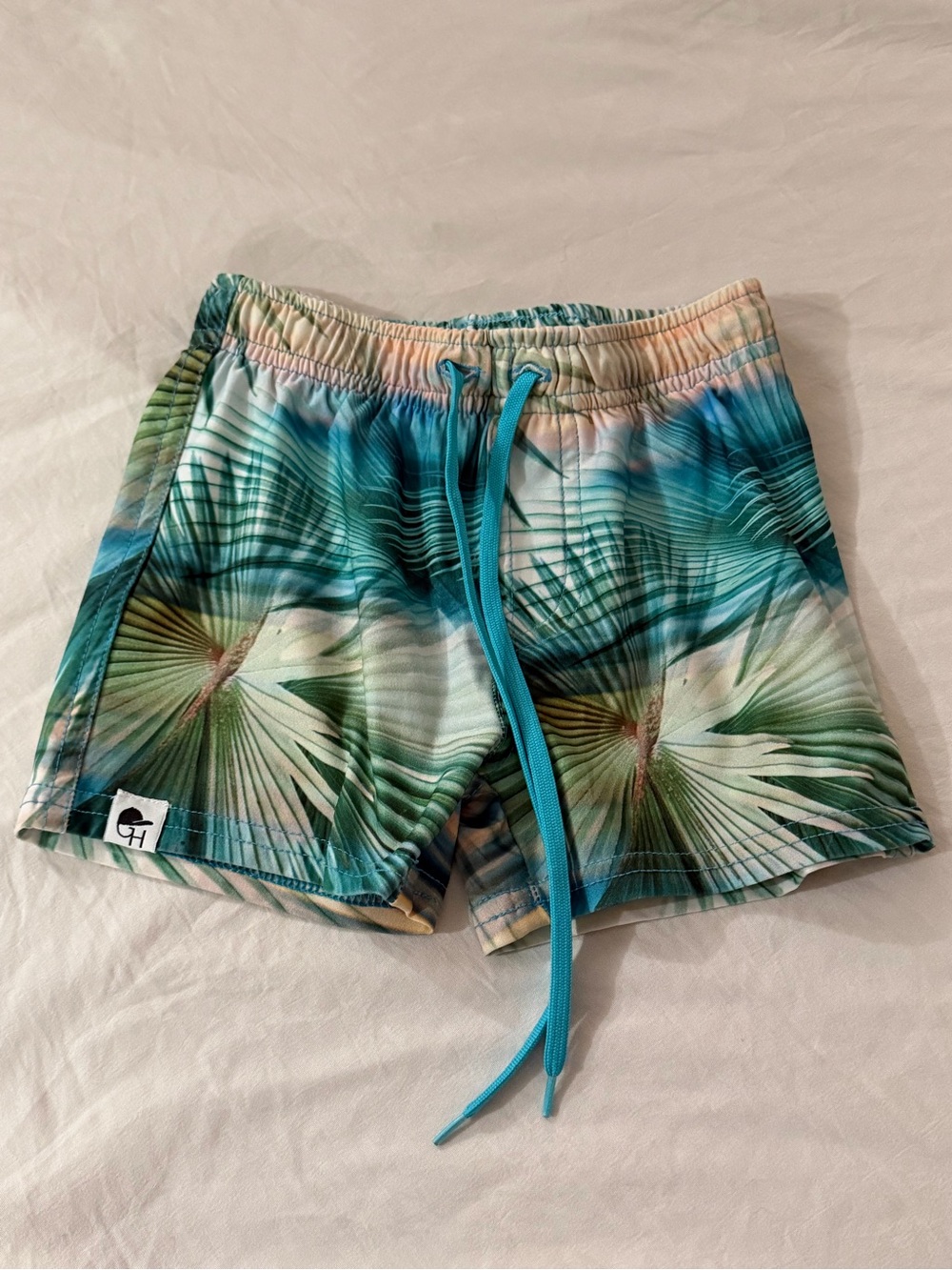 Kids Teal Palm-Print Swim Trunks